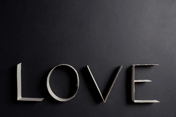 The word love made up of cardboard letters