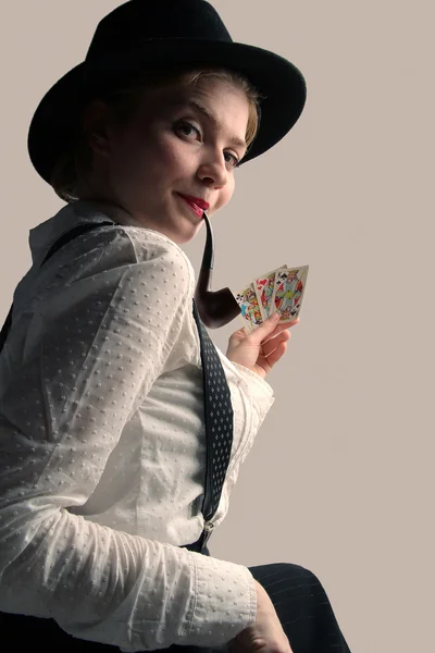 The beautiful unusual attractive girl with playing cards