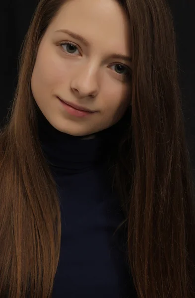 Portrait of the beautiful young girl with a long fair hair