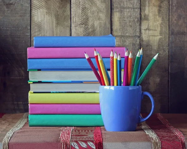 Books and colored pencils. Back to school.