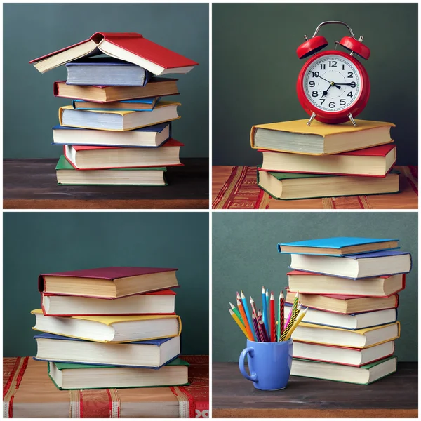 Pile of books on a wooden table.