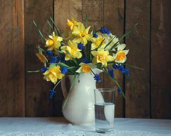 Still life with a bouquet of yellow narcissuses