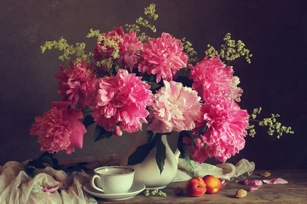 Still life with a bouquet of peonies.