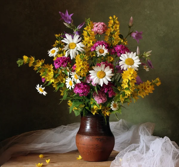 Still life with a bouquet of cultivated flowers