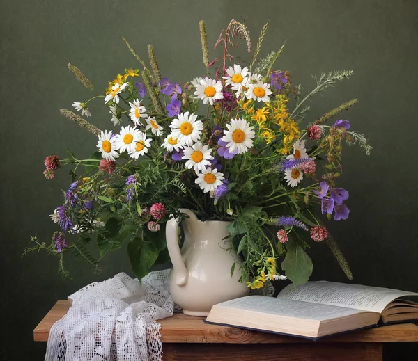 Still life with a summer bouquet of wild flowers