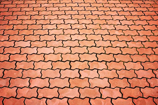 Paving from figured red tiles