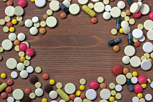 Scattering of medical tablets and capsules. Medicine. Top view.