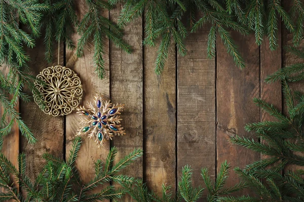 Background from boards with fir-tree branches from above