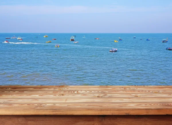 Empty table against the line of the horizon in the sea.