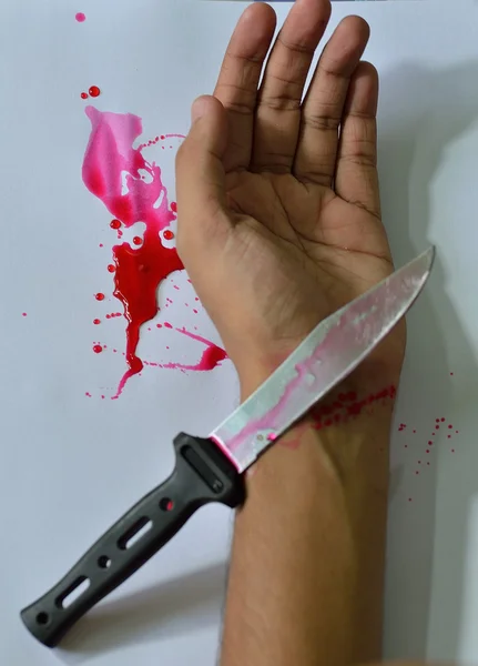 Knife hand and blood