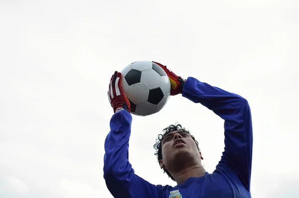 Soccer goalkeeper in white background