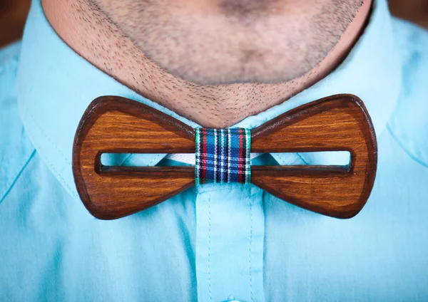 Man wearing a wooden tie.
