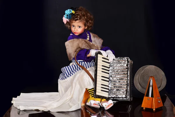 Cute little girl with an accordion