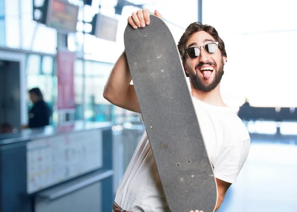 Young funny man with skateboard