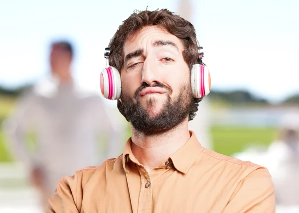 Crazy man listenig music in headphones