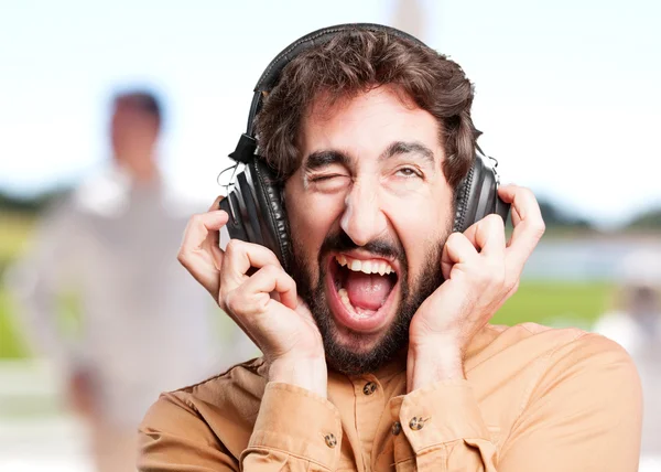 Crazy man listenig music in headphones