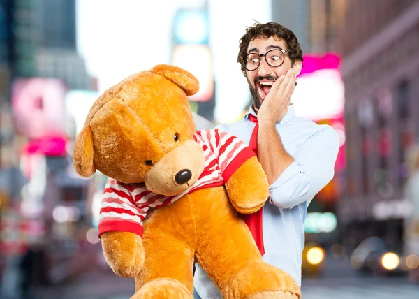 Crazy man with toy bear