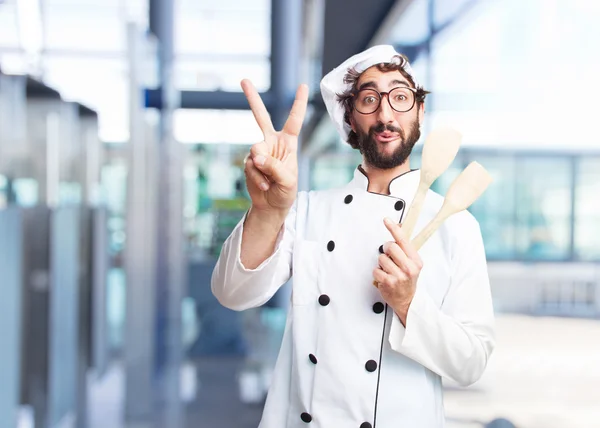 Crazy chef with wooden spoons