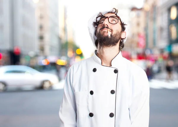 Crazy chef smoking a cigarette