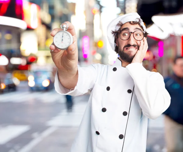 Crazy chef with stopwatch