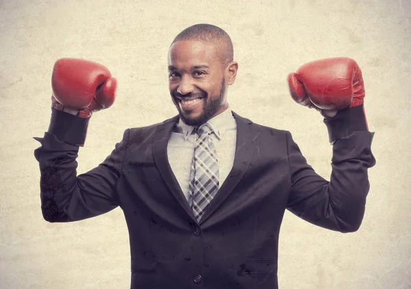 Young cool black man businessman boxing