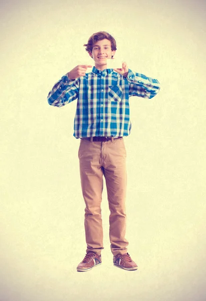 Teenager holding a name card