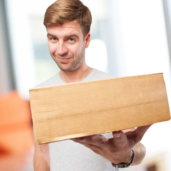 Blond man with a box