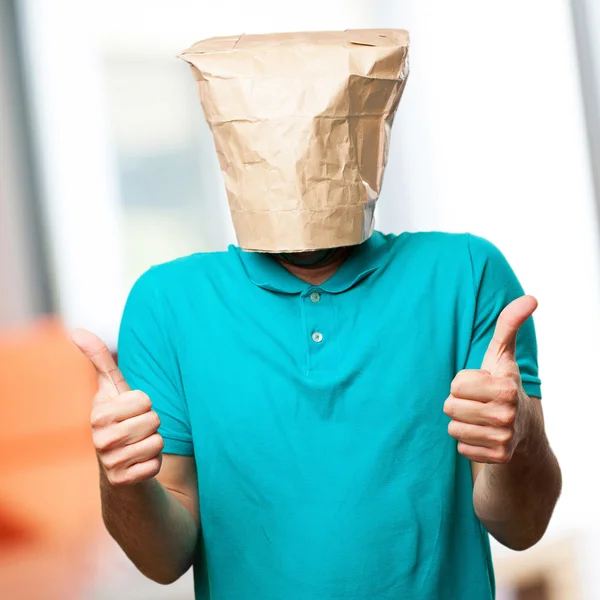 Crazy man with paper bag in his head