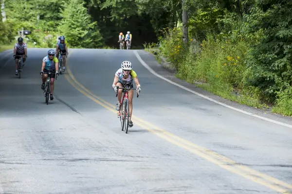 Cyclist pushing on a downhill run