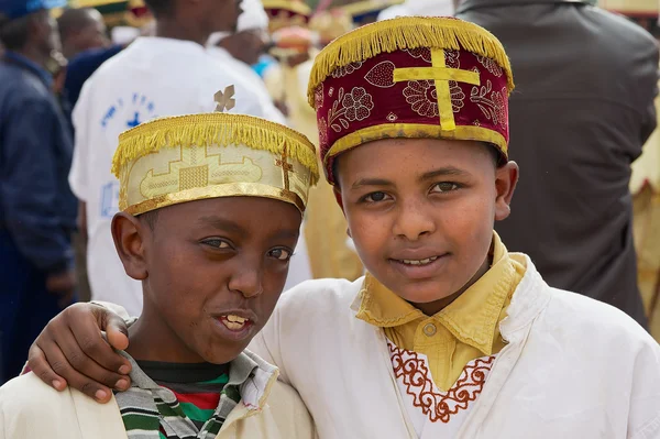 Portrait of two Ethiopian boys wearing traditional costumes during Timkat Christian Orthodox religious celebrations in Addis Ababa, Ethiopia.