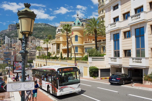 Public transportation bus passes by the street in Monaco, Monaco.