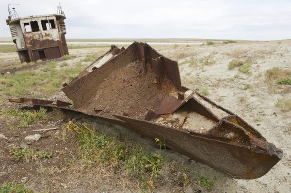 Rusted remains of fishing boat at the sea bed of the Aral sea, Aralsk, Kazakhstan.