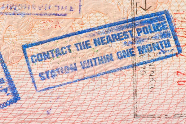 Passport page with Jordan immigration control stamp instructing to contact the nearest police station within one month.