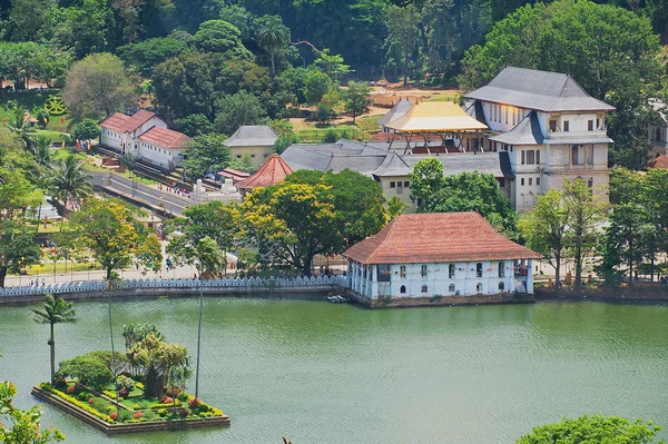 View to the Temple of the Tooth (Sri Dalada Maligawa) with golden roof reflecting the sun in Kandy, Sri Lanka.