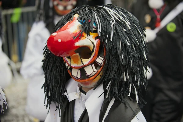 Person wears Waggis mask at Basel Carnival in Basel, Switzerland.