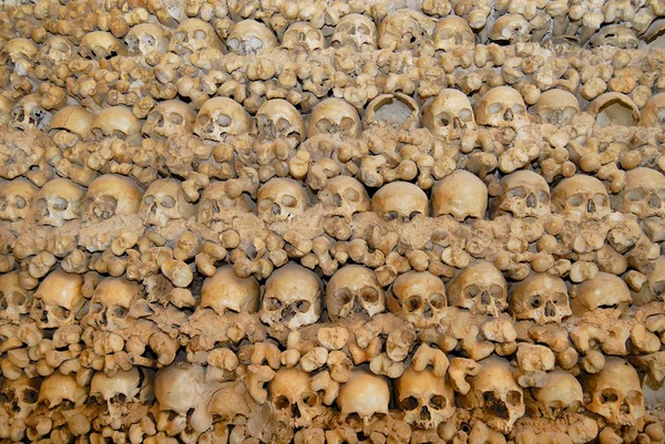 Human skulls and bones fixed in the wall of the Chapel of Bones (Capella dos Ossos) at Alcantarilha in Silves, Portugal.