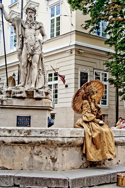 LVIV, UKRAINE - JUNE, 29: Gold living statue of woman, June 29, 2013