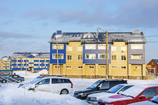 Modern three-storey brick house in a new area of the city