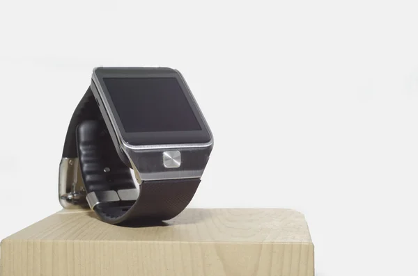 Black Smart watch on wooden box