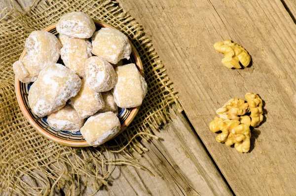 Crescent rolls stuffed with walnuts and powder sugar on traditio
