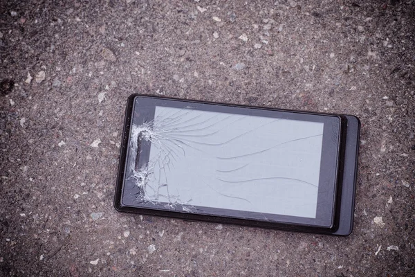 Cracked smartphone. Smartphone with cracked screen.