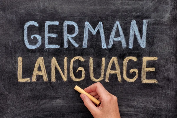 German language.  Hand drawing German Language on blackboard