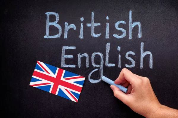 Hand drawing British English on blackboard