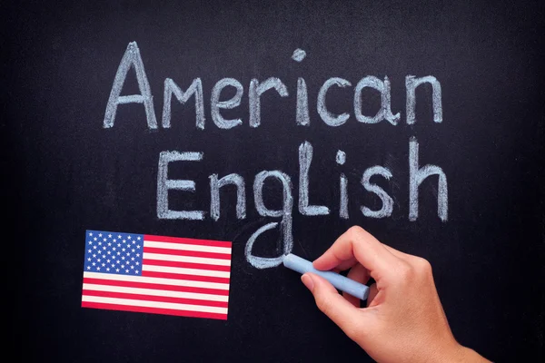 Hand drawing American English on blackboard