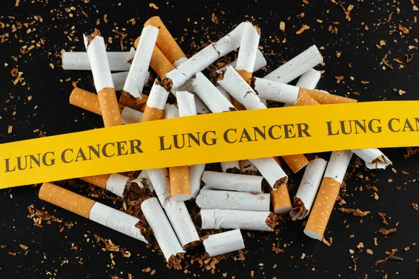 Broken cigarette with message Lung Cancer