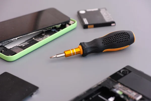 Repairing cellphone with screwdriver