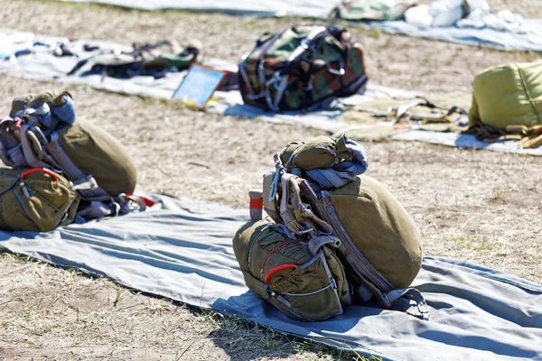 Packed parachutes on the ground