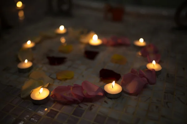 Candles red pink yellow rose petals big heart