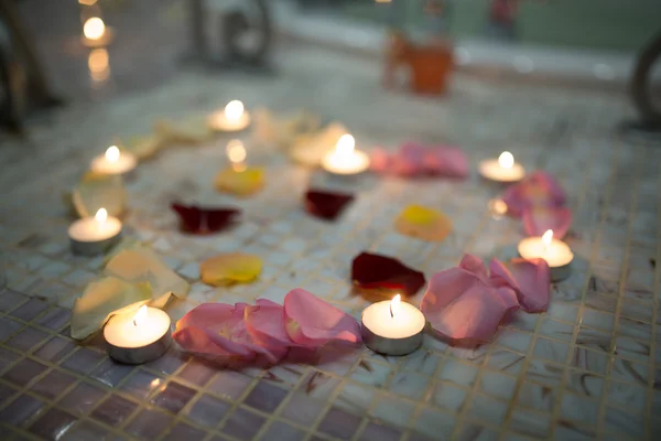 Candles red pink yellow rose petals big heart