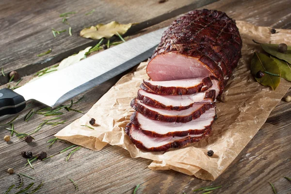 Smoked ham on a chopping board.